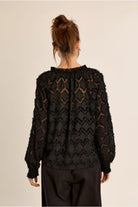 Molly Bracken black semi-sheer blouse back view
