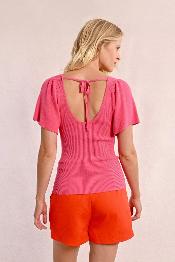 Molly Bracken pink summer top styled with high-waisted skirt from back 