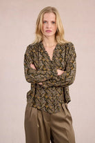 Model wearing Molly Bracken khaki paisley blouse with button-down front