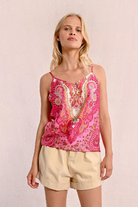 Model smiling in paisley Molly Bracken cami top with relaxed styling.