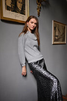 Front view of grey cowl neck jumper with sequins and balloon sleeves