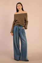 Front view of khaki cowl neck jumper with sequins and balloon sleeves worn off shoulder 