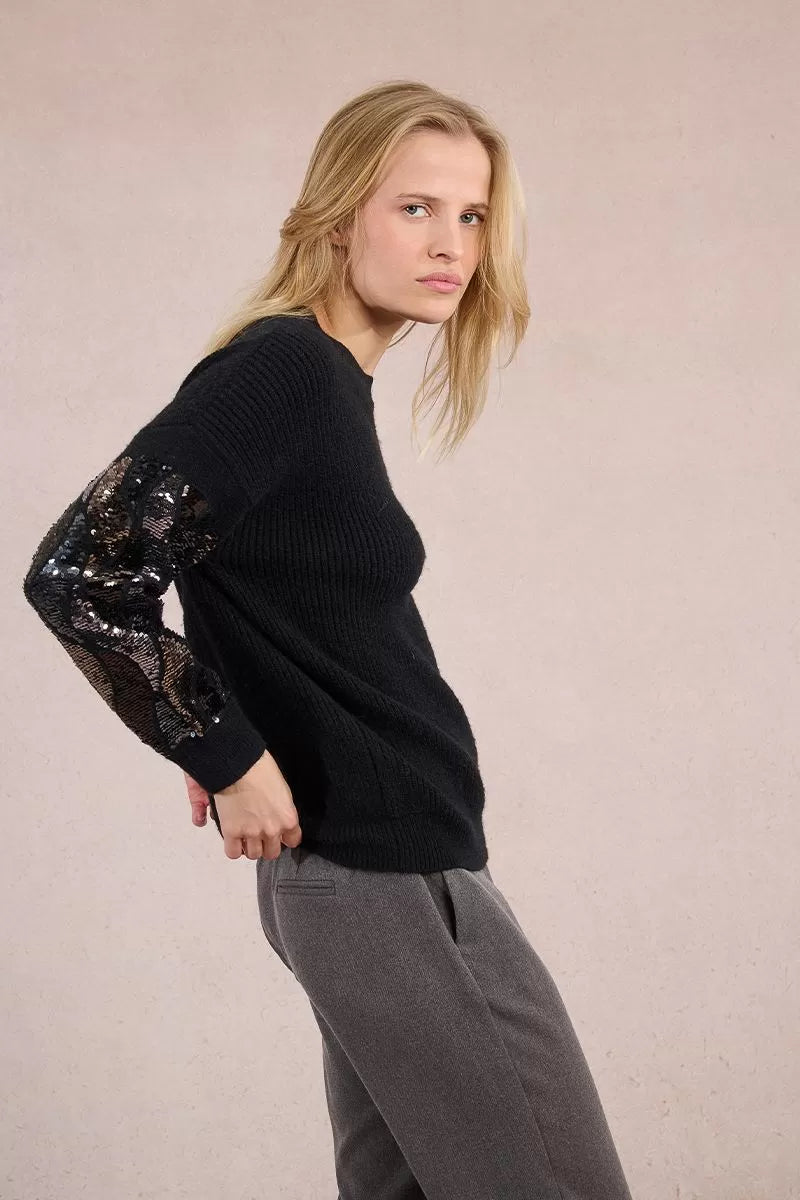 Side angle of Molly Bracken sequin sleeve black women’s sweater