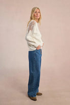 Side view of cream Molly Bracken jumper with sheer lace shoulder detail