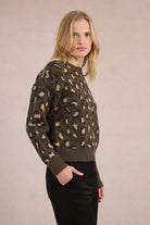 Model wearing Molly Bracken glittery khaki jumper with ribbed neckline