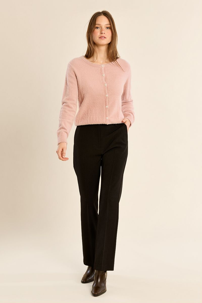 Molly Bracken pink fluffy knit cardigan worn with black trousers – full model view