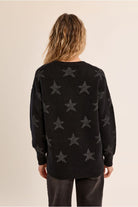 Molly Bracken black star knit jumper back view on model