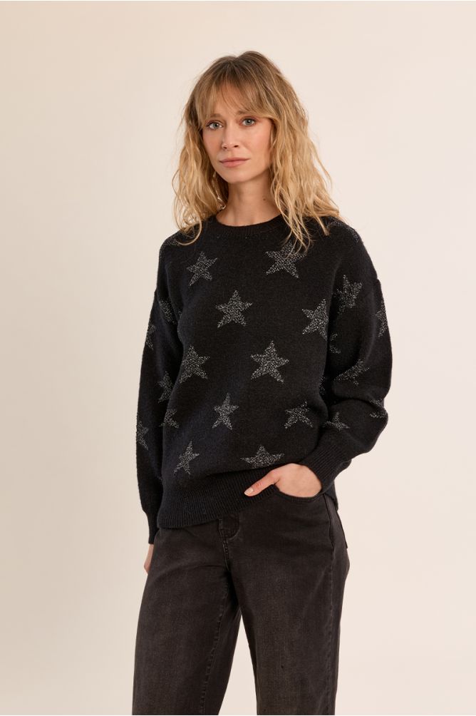 Molly Bracken black star knit jumper three-quarter view on woman