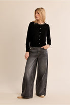 Molly Bracken women’s black sparkly knit cardigan styled with grey jeans