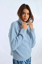 Women’s relaxed fit blue roll neck jumper with dropped shoulders