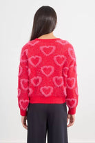 Red fuzzy knit sweater with all-over heart motifs back view