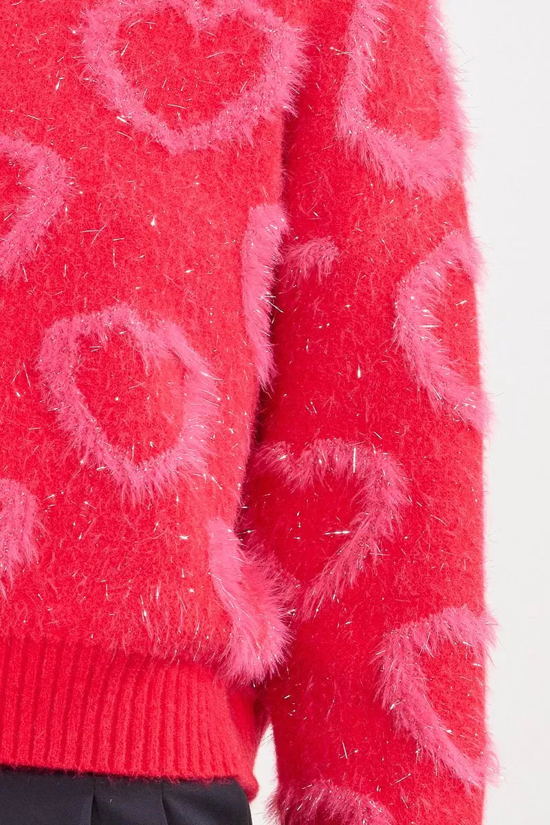 Close-up of fuzzy heart motif on Molly Bracken red jumper