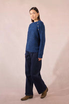 Full-length view of Molly Bracken women’s blue knit jumper styled with trousers
