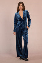 Molly Bracken straight cut blue velvet blazer styled with matching wide-leg trousers, side angle