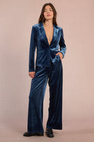 Molly Bracken straight cut velvet blazer in blue with wide lapels and single button closure, styled with matching velvet trousers