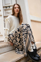 Molly Bracken boho print long skirt in black and beige styled with cream knit and black boots
