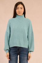 Front view of Molly Bracken aqua blue sequin puff sleeve knit jumper with high neck