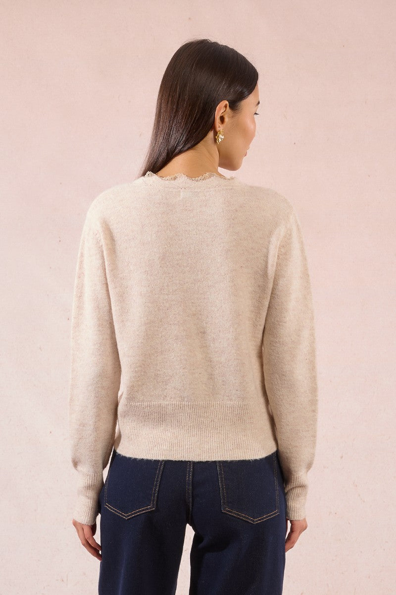 Back view of Molly Bracken cream lace knit cardigan with scalloped edge finish.