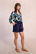 High-waisted navy shorts with elasticated back and structured front