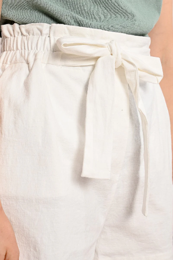 Front view of Molly Bracken high-waist white belted shorts