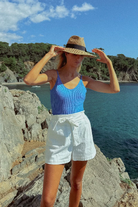 Relaxed fit white shorts with elastic waist and side pockets