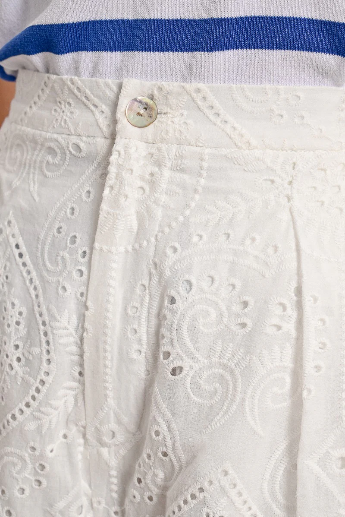 White broderie anglaise shorts with soft pleating and feminine shape