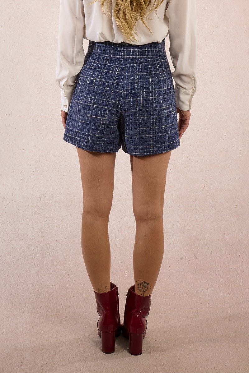 Back view of Molly Bracken flared tweed winter shorts in navy