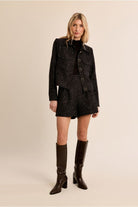 Molly Bracken black bouclé jacket styled with matching shorts