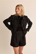Molly Bracken black bouclé short tweed jacket front view on model