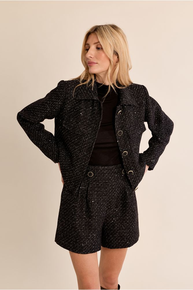 Molly Bracken black bouclé short tweed jacket front view on model