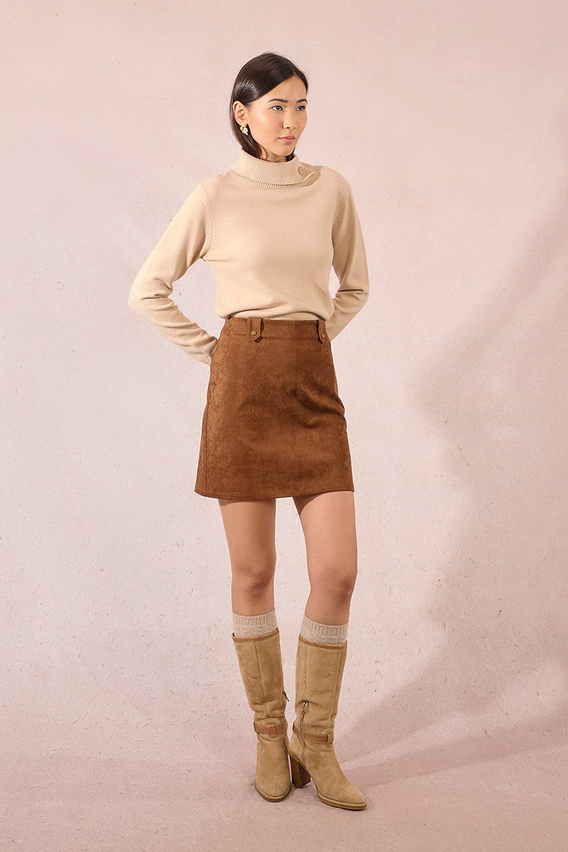 Model wearing Molly Bracken camel faux suede mini skirt styled with beige roll-neck and knee-high boots.