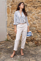 Molly Bracken carrot leg trousers off white lifestyle image