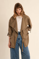 Molly Bracken women’s khaki trench jacket styled with denim