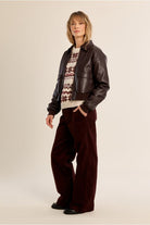 Molly Bracken women’s brown faux leather bomber jacket styled on model