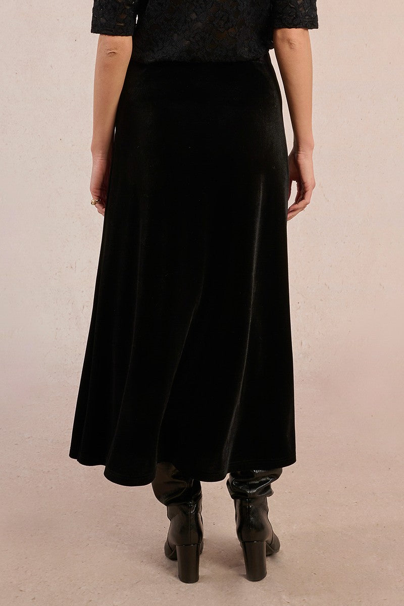 Back view of Molly Bracken long velvet maxi skirt in black with straight fit.