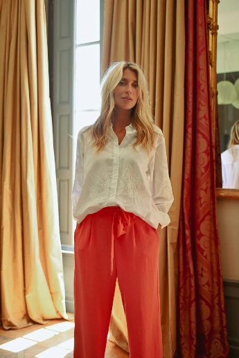 Molly Bracken embroidered shirt styled tucked over orange summer trousers
