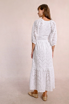 Back view of broderie lace midi dress with feminine silhouette