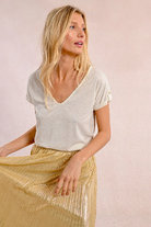 V neckline and relaxed fit of Molly Bracken off-white lace back T-shirt
