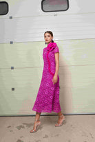 Moskada Zahara pink lace midi dress side view with ruffle floral trim