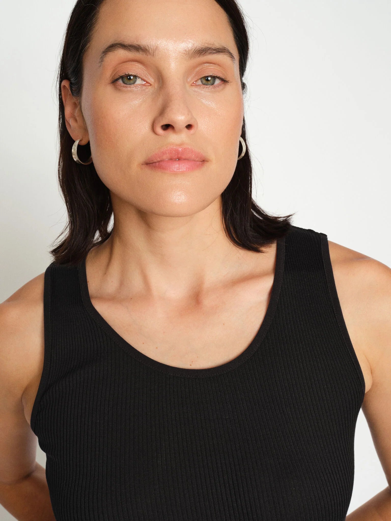 Close-up of Mos Mosh black ribbed tank with round neckline