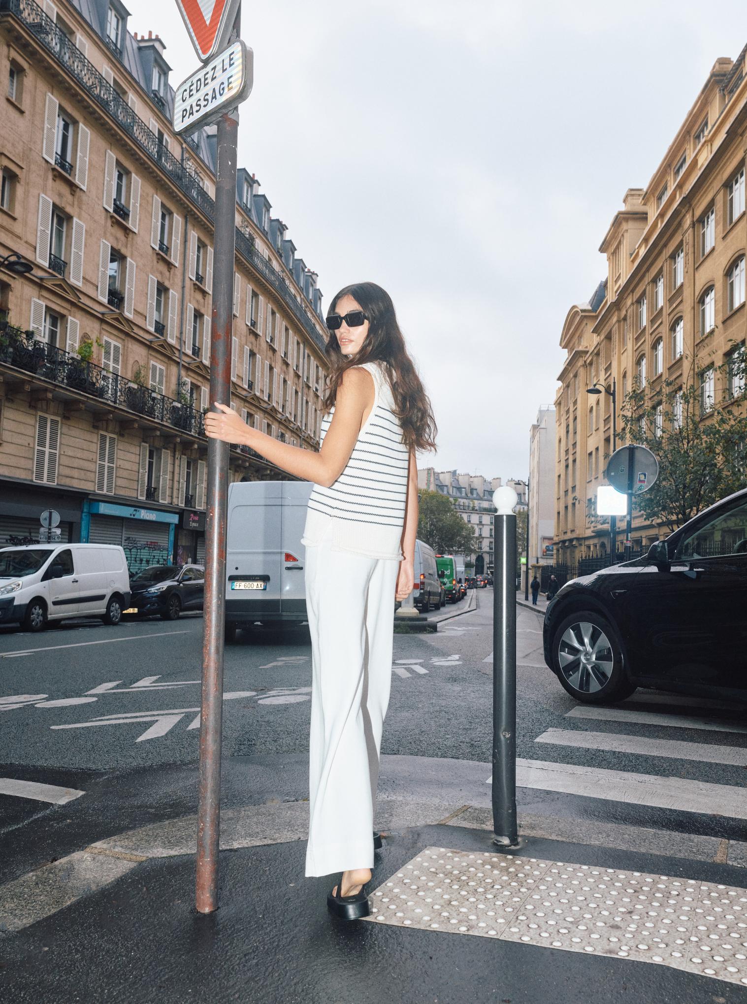 Side 
 view of Mos Mosh white high-waisted lyocell trousers styled with striped summer top