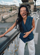 Mos Mosh white trousers styled with teal sleeveless top