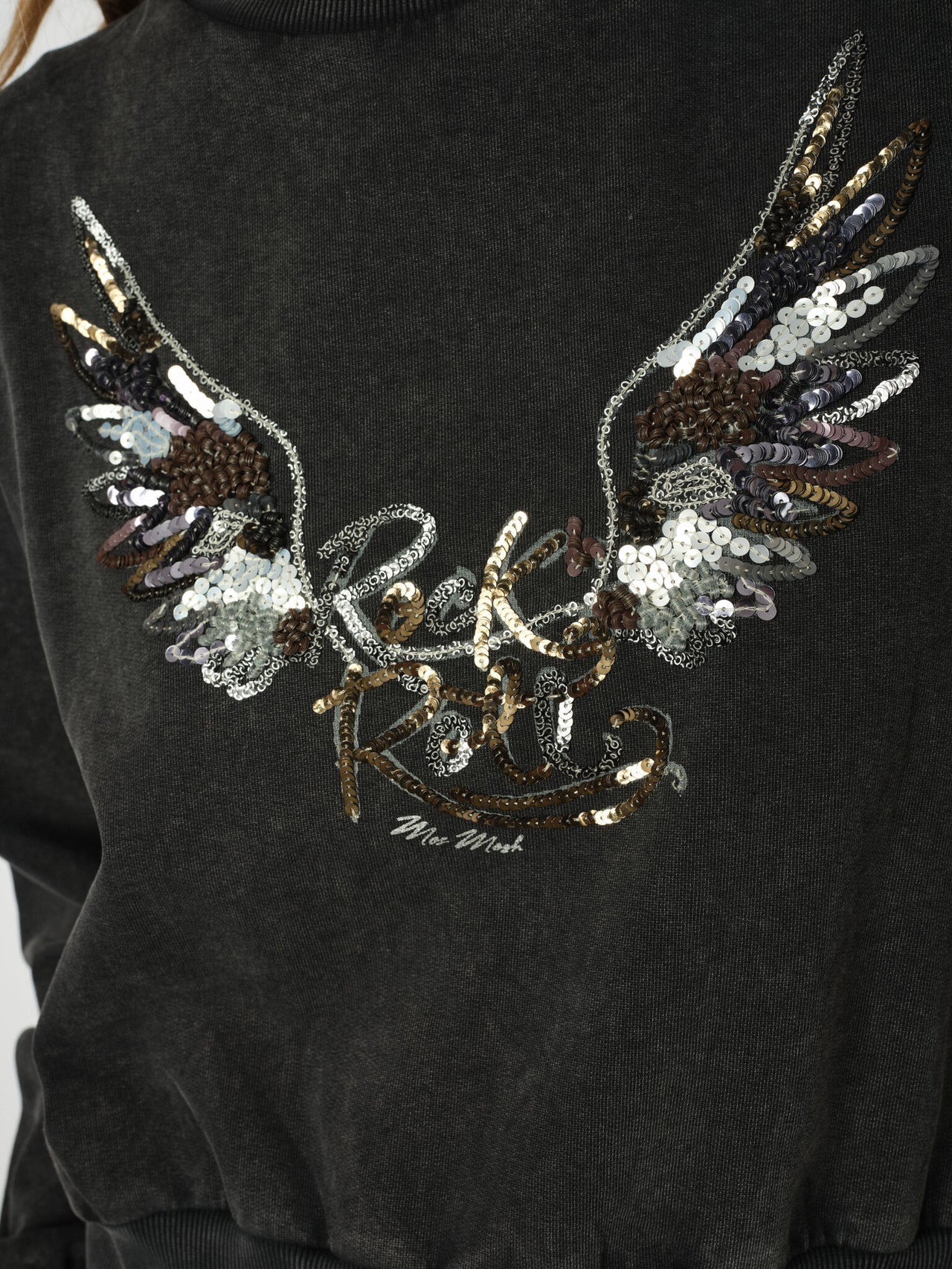 Close up amart-casual grey sequin jumper by Mos Mosh styled with trousers