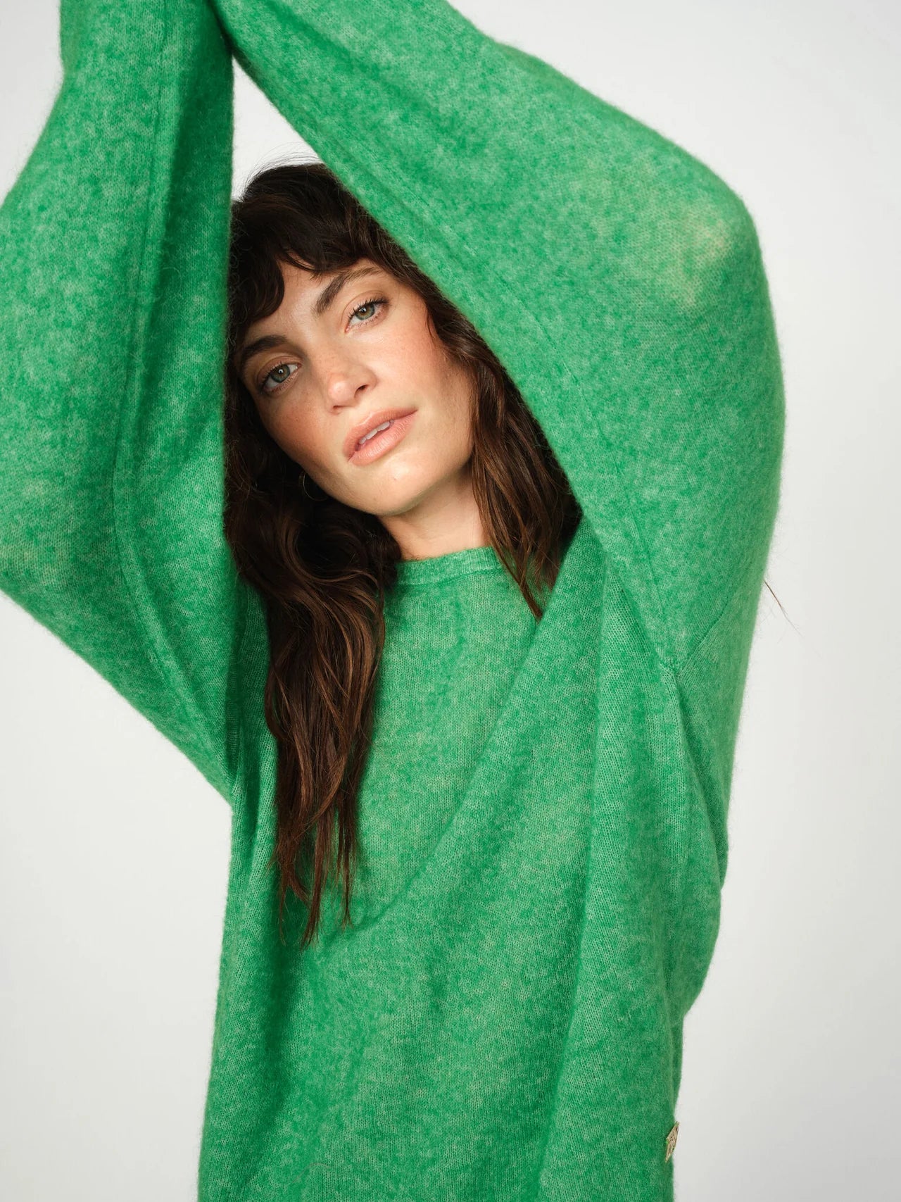 Close-up of green wool texture on Mos Mosh Mape jumper