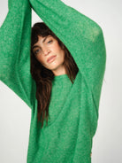 Close-up of green wool texture on Mos Mosh Mape jumper
