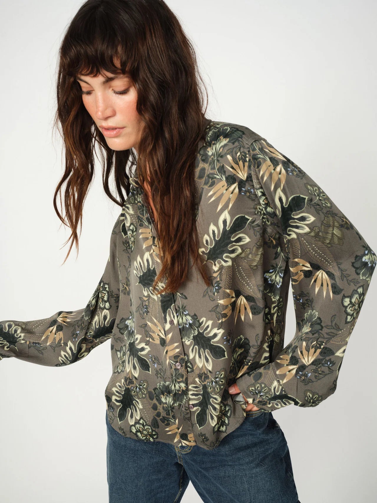 Close-up of floral print and buttoned cuffs on green Mos Mosh shirt