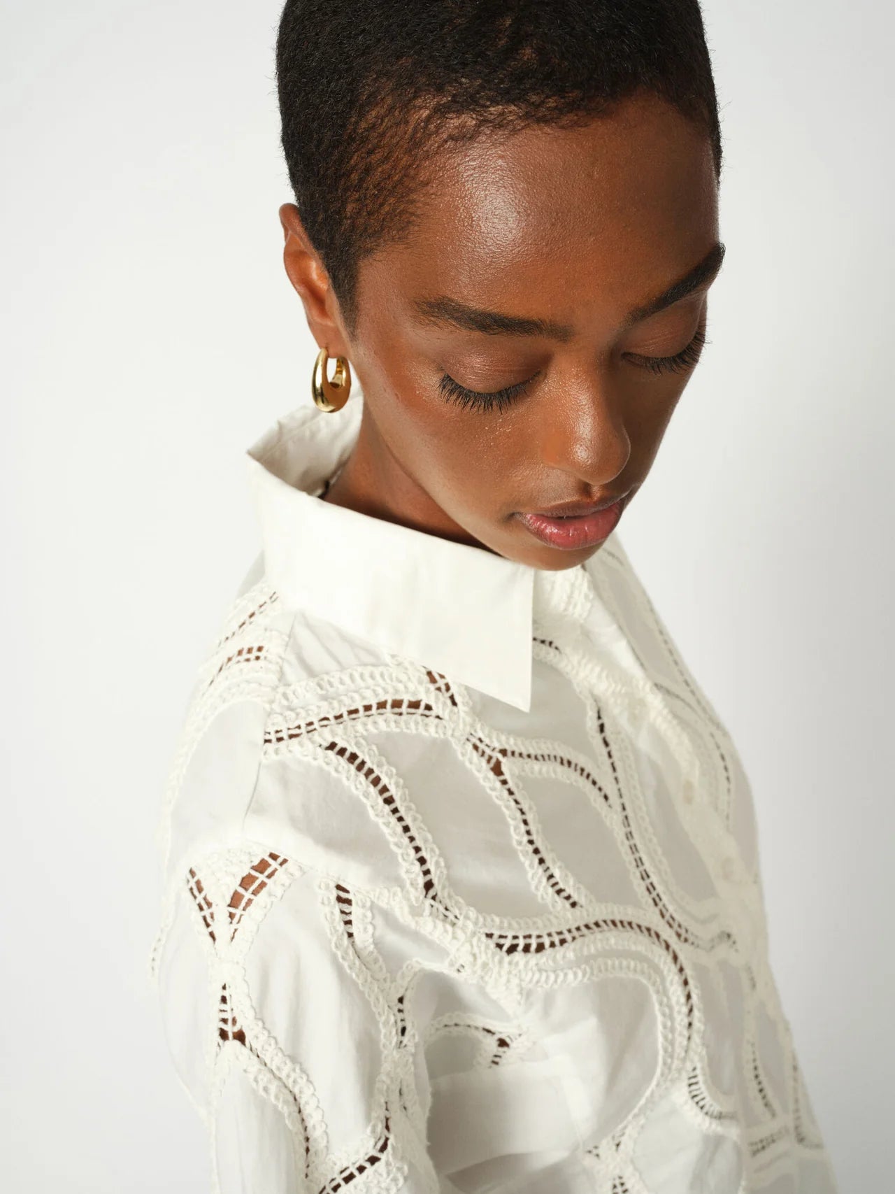 Model wearing Nolin Caminno shirt styled with tailored trousers