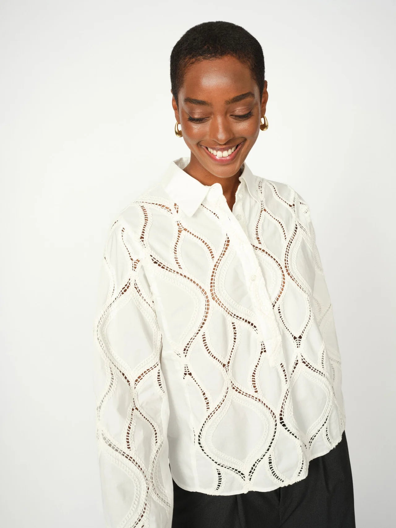 Back view of cream openwork Mos Mosh shirt with elasticated cuffs