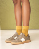 NeroGiardini Italian suede trainer on model – Beige style with mustard socks