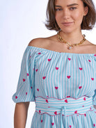 Close up blue stripe dress pink hearts waistband detail